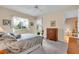 Bright main bedroom with a comfortable bed, natural light, and a view of the outdoors, creating a relaxing ambiance at 6908 Stoneywalk Ct, Bradenton, FL 34203