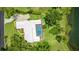 Aerial view of home with white roof, screened pool, lush green lawn, and manicured landscaping at 7404 Weeping Willow Blvd, Sarasota, FL 34241