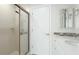 Bright bathroom with glass enclosed shower and stylish white vanity at 7404 Weeping Willow Blvd, Sarasota, FL 34241