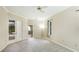 Neutral bedroom with carpet and views of the backyard, pool and french door access at 7404 Weeping Willow Blvd, Sarasota, FL 34241