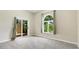 Bedroom with backyard views and a sliding door leading to outside at 7404 Weeping Willow Blvd, Sarasota, FL 34241