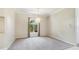 Elegant dining room with neutral carpet and a window with view of the garden at 7404 Weeping Willow Blvd, Sarasota, FL 34241