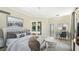 Spacious main bedroom with pool view, desk, and calming decor at 7404 Weeping Willow Blvd, Sarasota, FL 34241