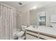 Well-lit bathroom featuring a tub with shower and modern vanity with white countertop at 7866 Eagle Creek Dr # 7866, Sarasota, FL 34243