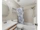 This bathroom features a tub/shower combo with tile surround, and a modern vanity with wood accents at 7866 Eagle Creek Dr # 7866, Sarasota, FL 34243