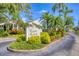 Inviting entrance to Eagle Creek community showcasing lush landscaping and manicured lawns at 7866 Eagle Creek Dr # 7866, Sarasota, FL 34243