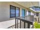 Exterior close up of a condo entrance showing a blue door and black framed window at 7866 Eagle Creek Dr # 7866, Sarasota, FL 34243