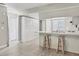 Open-concept kitchen and living space with a breakfast bar and sleek hard wood floors at 7866 Eagle Creek Dr # 7866, Sarasota, FL 34243