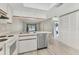 This kitchen shows a stainless dishwasher and appliances and overlooks the living area at 7866 Eagle Creek Dr # 7866, Sarasota, FL 34243