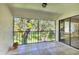 Enjoy a relaxing outdoor atmosphere from this lanai overlooking green space with mature trees at 7866 Eagle Creek Dr # 7866, Sarasota, FL 34243