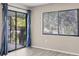 Bright living room with sliding glass door to outdoor space, lots of natural light at 7866 Eagle Creek Dr # 7866, Sarasota, FL 34243