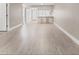 Open-concept living space featuring sleek floors and a breakfast bar with seating at 7866 Eagle Creek Dr # 7866, Sarasota, FL 34243