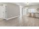 Living room area view of kitchen bar and breakfast nook and lots of natural light at 7866 Eagle Creek Dr # 7866, Sarasota, FL 34243