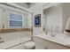 Bathroom showcasing a glass shower, vanity sink, and neutral tones, creating a spa-like atmosphere at 8102 Waterview Blvd, Lakewood Ranch, FL 34202