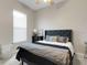Bedroom featuring carpet, an inviting decor scheme, and natural light, creating a comfortable and relaxing retreat at 8102 Waterview Blvd, Lakewood Ranch, FL 34202