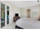 Bright bedroom with patio access, television and carpet at 8102 Waterview Blvd, Lakewood Ranch, FL 34202