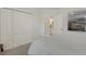 Neutral bedroom featuring a large closet, carpet and artwork at 8102 Waterview Blvd, Lakewood Ranch, FL 34202