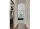 View of the bedroom with bay window and ceiling fan through the walk-in closet and hallway at 8102 Waterview Blvd, Lakewood Ranch, FL 34202