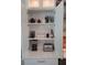 Organized coffee bar with a coffee maker and toaster, plus shelving for mugs, supplies, and spirits at 8102 Waterview Blvd, Lakewood Ranch, FL 34202