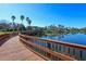 Scenic view of a wooden boardwalk and gazebo overlooking a calm lake in the Edgewater Village community at 8102 Waterview Blvd, Lakewood Ranch, FL 34202