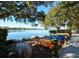 Kayaks and canoes await by a serene lake in the Edgewater Village community, with lush greenery at 8102 Waterview Blvd, Lakewood Ranch, FL 34202