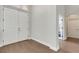 Inviting foyer with a double-door entrance, hardwood floors, and neutral color scheme at 8102 Waterview Blvd, Lakewood Ranch, FL 34202