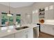 Bright kitchen with white cabinetry, stainless steel appliances, and a center island at 8102 Waterview Blvd, Lakewood Ranch, FL 34202