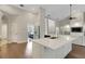 Open concept kitchen features quartz countertops, stainless steel appliances, and hardwood floors at 8102 Waterview Blvd, Lakewood Ranch, FL 34202