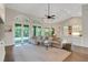 Open living area featuring lots of light, neutral color palette, and view to the kitchen and lanai at 8102 Waterview Blvd, Lakewood Ranch, FL 34202