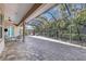 Expansive screened-in patio featuring brick flooring, offering a relaxing and versatile outdoor living space at 8102 Waterview Blvd, Lakewood Ranch, FL 34202