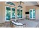 Covered patio with neutral tones, a ceiling fan, and furniture, perfect for outdoor relaxation at 8102 Waterview Blvd, Lakewood Ranch, FL 34202
