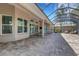 Spacious screened patio with brick flooring, offering scenic views and ample space for outdoor living at 8102 Waterview Blvd, Lakewood Ranch, FL 34202