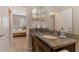 Bathroom with dark wood cabinet and granite countertops at 8417 Karpeal Dr # 4, Sarasota, FL 34238