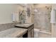 Bathroom with granite countertops and tiled shower at 8417 Karpeal Dr # 4, Sarasota, FL 34238