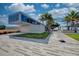 Modern Siesta Beach pavilion featuring a sleek design, palm trees, and inviting green spaces at 8417 Karpeal Dr # 4, Sarasota, FL 34238