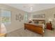 Serene bedroom with natural light, comfortable furnishings, and a view of the outdoors at 8417 Karpeal Dr # 4, Sarasota, FL 34238