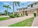 Inviting two-story townhomes with brick driveways, lush landscaping and well maintained exteriors at 8417 Karpeal Dr # 4, Sarasota, FL 34238