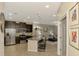 Open concept kitchen with granite counters, stainless steel appliances and seating area at 8417 Karpeal Dr # 4, Sarasota, FL 34238