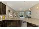 Kitchen featuring granite countertops, stainless appliances and an open design flowing into the living room at 8417 Karpeal Dr # 4, Sarasota, FL 34238