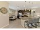 Well-lit kitchen with pendant lighting, dark cabinets, stainless appliances, and dining area at 8417 Karpeal Dr # 4, Sarasota, FL 34238