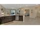 Well-equipped kitchen with stainless steel appliances, granite countertops, and seamless flow to living spaces at 8417 Karpeal Dr # 4, Sarasota, FL 34238
