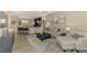 Open-concept living room connecting to the kitchen with comfortable seating and stylish decor at 8417 Karpeal Dr # 4, Sarasota, FL 34238