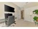 Large office space with mounted TV and lots of storage at 8417 Karpeal Dr # 4, Sarasota, FL 34238