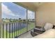 Enjoy the serene lake views from the screened patio, complete with comfortable seating at 8417 Karpeal Dr # 4, Sarasota, FL 34238