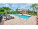 Resort-style community pool with a covered cabana and lounge chairs for relaxing by the water at 8417 Karpeal Dr # 4, Sarasota, FL 34238