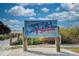 A vibrant sign welcomes visitors to Siesta Beach, ranked #1 in the USA, under a sunny sky at 8417 Karpeal Dr # 4, Sarasota, FL 34238