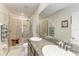 Bathroom features a double sink vanity and a glass enclosed shower with tiled walls at 8676 Ice Wine St, Sarasota, FL 34238
