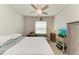 Bedroom featuring a full bed, a TV, a study space and natural light from the window at 8676 Ice Wine St, Sarasota, FL 34238