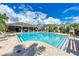 Inviting community pool with comfortable lounge seating and a covered clubhouse area at 8676 Ice Wine St, Sarasota, FL 34238