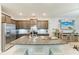 Stylish kitchen with granite countertops, stainless steel appliances, and an eat-in island at 8676 Ice Wine St, Sarasota, FL 34238